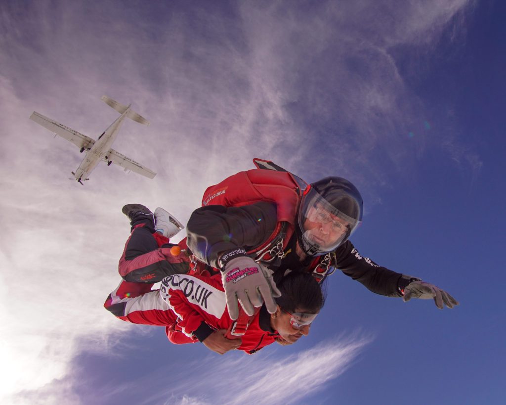 Tandem skydiving near Leeds with instructor and jumper above the North West