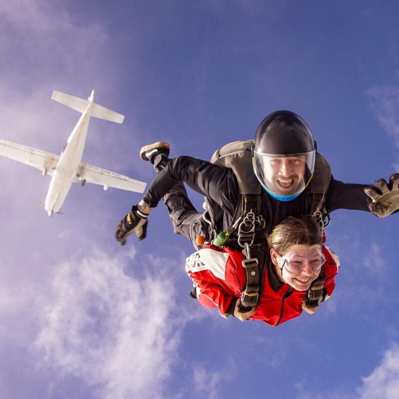 Tandem skydiving from an aircraft with instructor and jumper in freefall